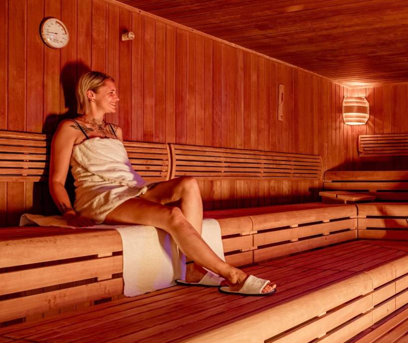 Guest relaxing in the sauna during the Spring Spa Package at Rugard Thermal Strandhotel in Binz.